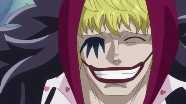 Donquixote Rosinante (Corazon) smiling widely in his red hoodie with face paint, One Piece anime.