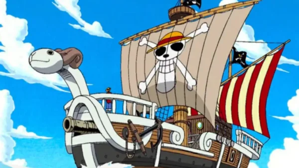 Going Merry ship sailing under clear skies with the Straw Hat Pirates’ jolly roger on its sail, One Piece.