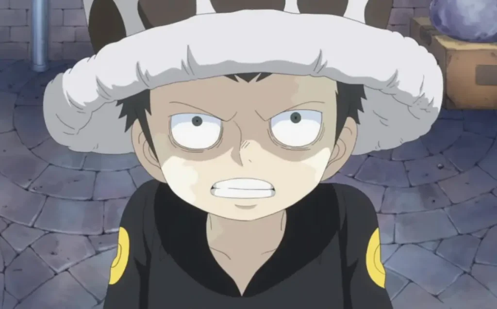 Young Trafalgar Law looking furious while wearing his spotted hat, One Piece anime.