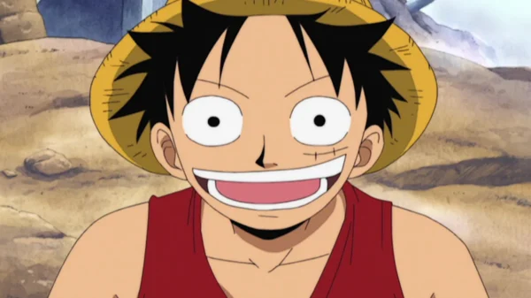 Monkey D. Luffy smiling brightly in his iconic straw hat and red vest, hiding his pain behind laughter during the early One Piece adventures.